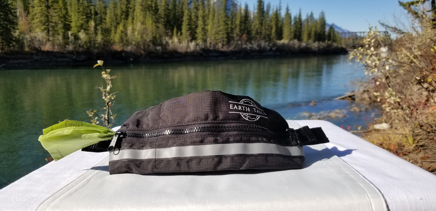 Little helper pouch shown on display table in front of river and trees